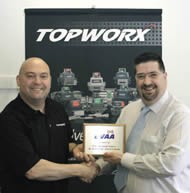 Topworx: Sales Director Tony Stark receives his plaque.